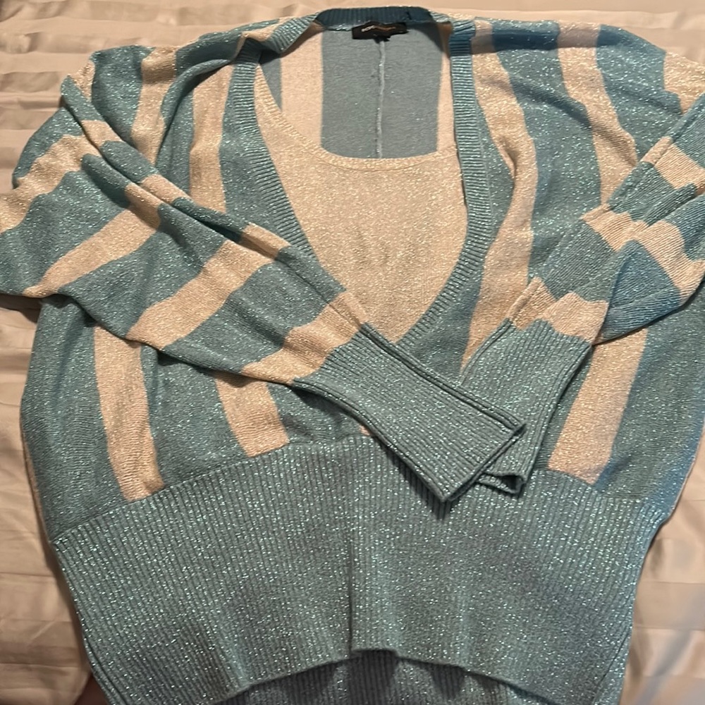 New never been used. Long sleeve multi color with shine light weight sweater.